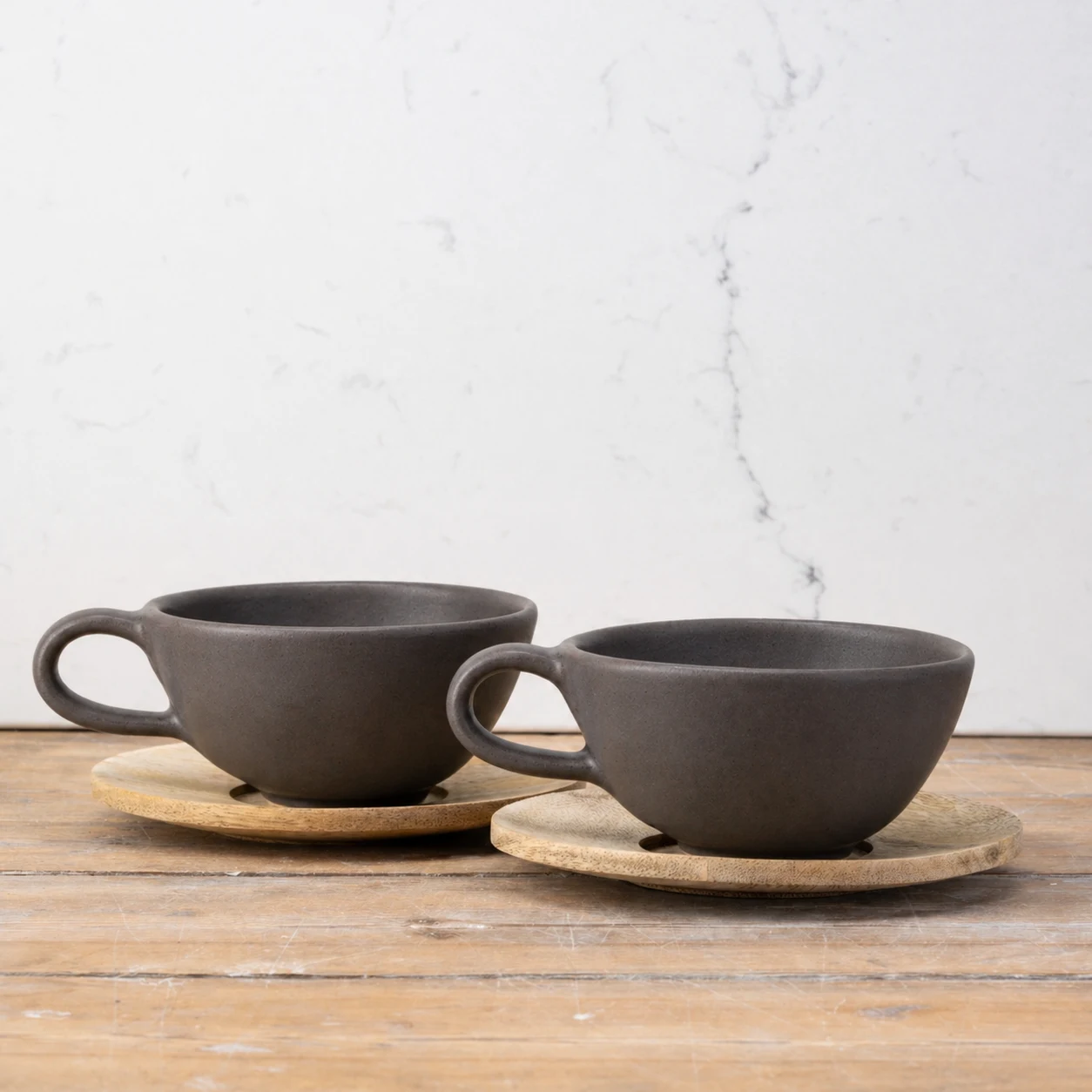 2 Charcoal Wonky mugs with wooden saucers
