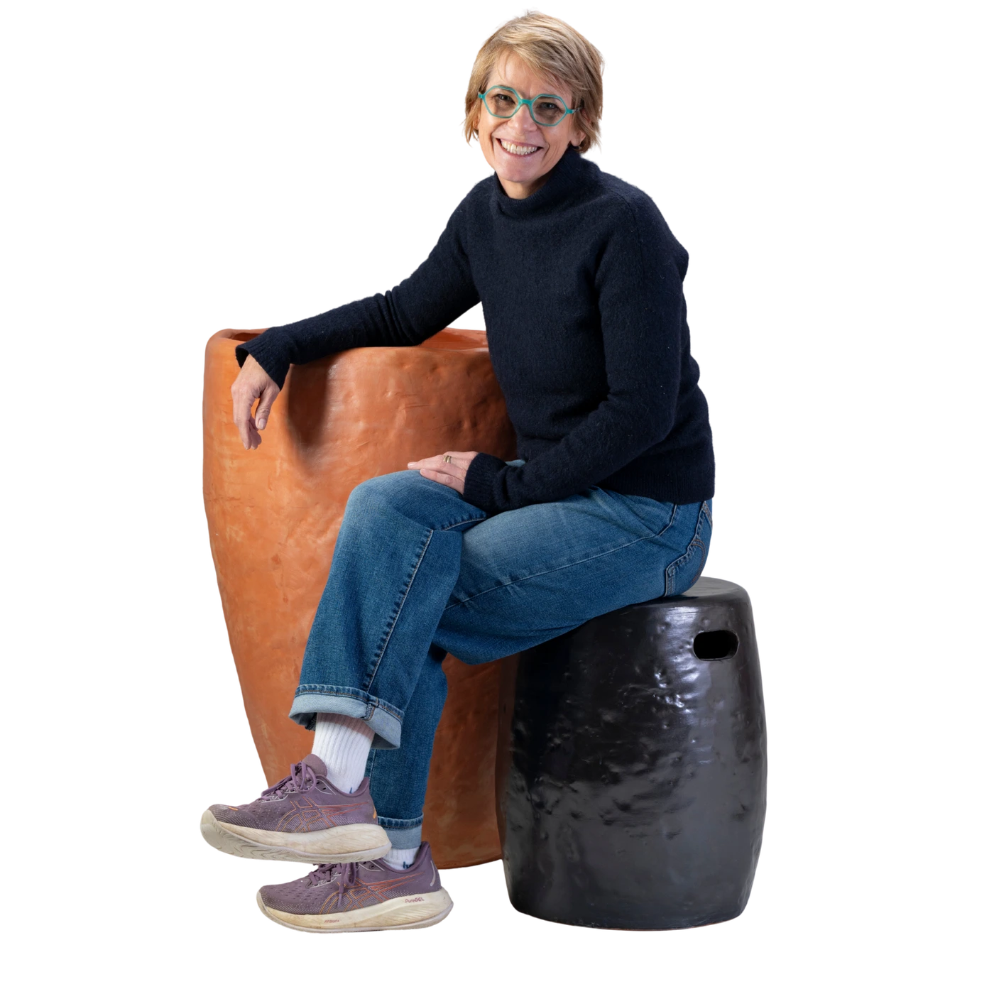 Nicole Kingston seated beside a handmade terracotta pot