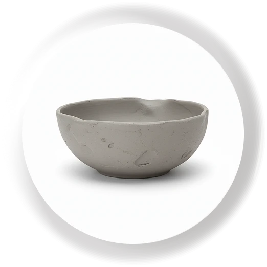 A newly shaped clay bowl in a circular frame